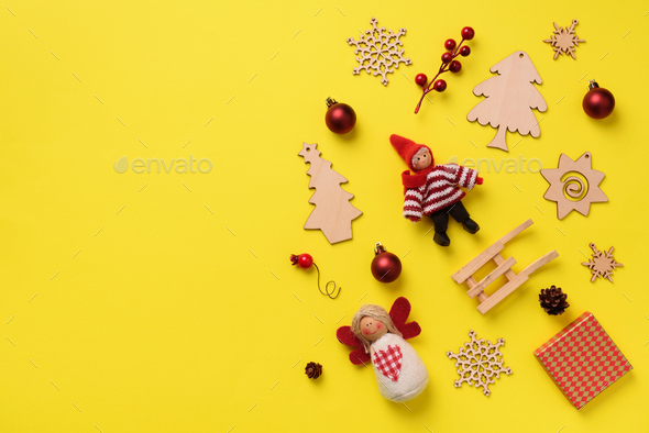 Greeting card for New year party. Christmas gifts, decorative elements and ornaments on yellow - Stock Photo - Images