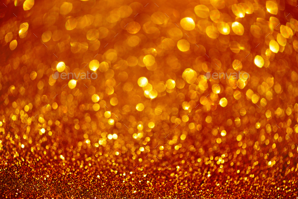 Red and gold abstract bokeh lights. Shiny glitter background with copy  space. New year and Christmas Stock Photo by jchizhe