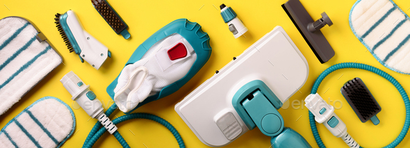 Set with modern professional steam cleaners on yellow background. Top view, flat lay. Banner with - Stock Photo - Images
