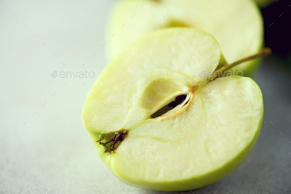 Organic green vegetables and fruits on grey background. Copy space. Green apple, lettuce, cucumber - Stock Photo - Images