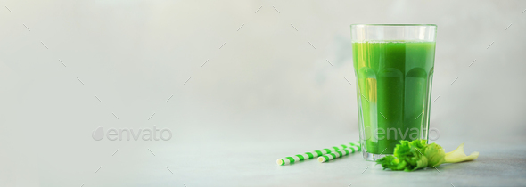 Glass of green celery smoothie on grey concrete background. Banner with copy space. Fresh juice for - Stock Photo - Images