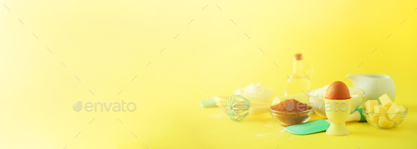 Turquoise and yellow cooking utensils on bright background. Food ingredients. Macro of eggs. Cooking - Stock Photo - Images