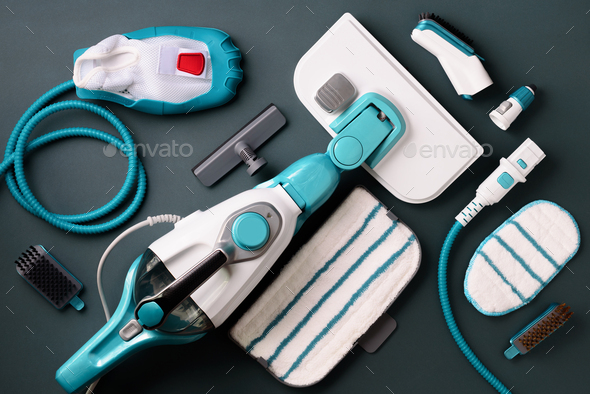 Kit of modern professional steam cleaners on grey background. Top view, flat lay. Banner with copy - Stock Photo - Images