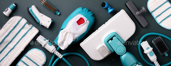 Set with modern professional steam cleaners on grey background. Top view, flat lay. Banner with copy - Stock Photo - Images