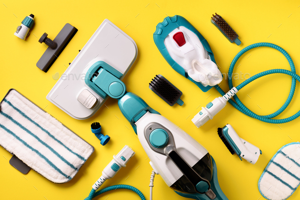 Set with modern professional steam cleaners on yellow background. Top view, flat lay. Banner with - Stock Photo - Images