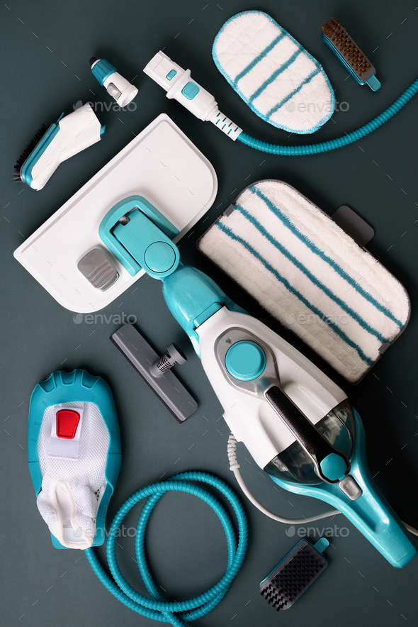Set with modern professional steam cleaners on grey background. Top view, flat lay. Banner with copy - Stock Photo - Images