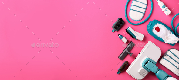 Kit of modern professional steam cleaners on pink background. Top view, flat lay. Banner with copy - Stock Photo - Images