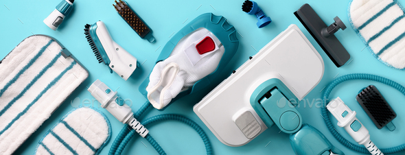 Set with modern professional steam cleaners on blue background. Top view, flat lay. Banner with copy - Stock Photo - Images