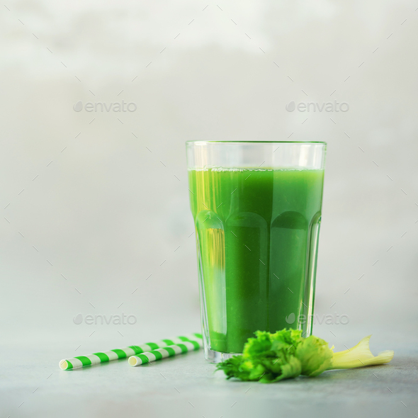 Glass of green celery smoothie on grey concrete background. Banner with copy space. Square crop - Stock Photo - Images