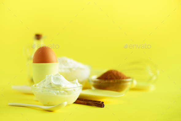Holiday bakery background. Food frame - butter, sugar, flour, milk, eggs, oil, spoon, rolling pin - Stock Photo - Images