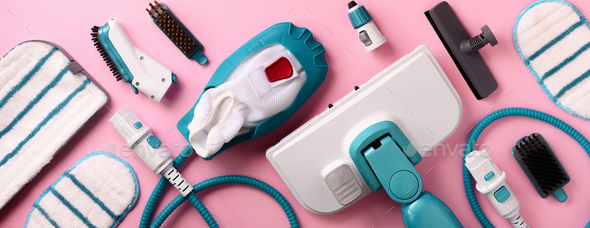 Set with modern professional steam cleaners on pink background. Top view, flat lay. Banner with copy - Stock Photo - Images