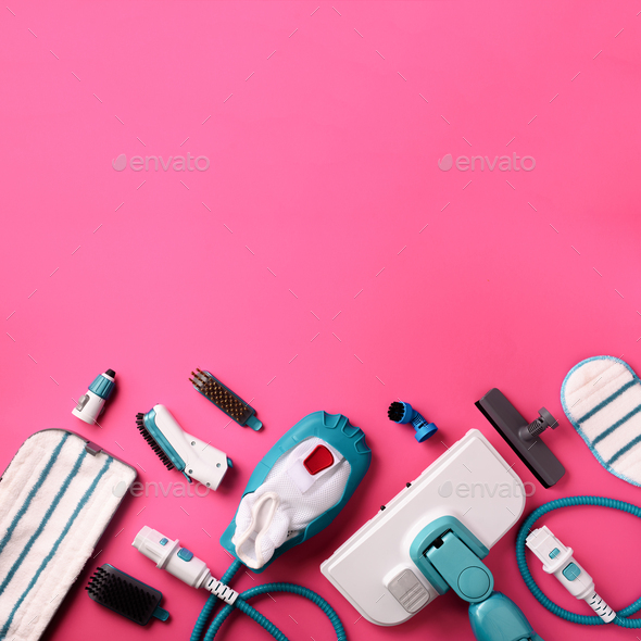 Set with modern professional steam cleaners on pink background. Top view, flat lay. Banner with copy - Stock Photo - Images