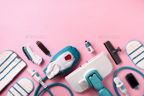 Kit of modern professional steam cleaners on pink background. Top view, flat lay. Banner with copy - Stock Photo - Images