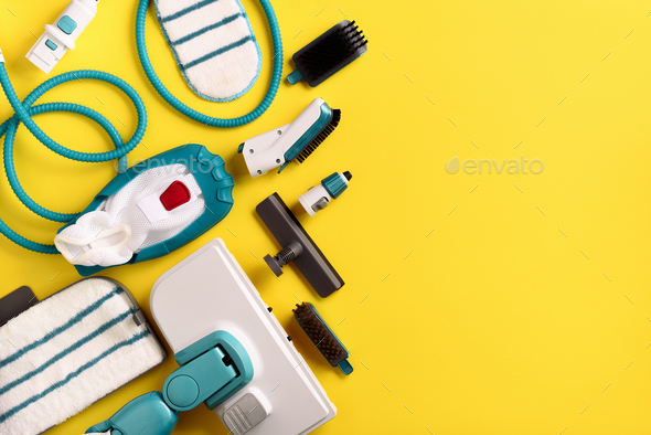 Set with modern professional steam cleaners on yellow background. Top view, flat lay. Banner with - Stock Photo - Images