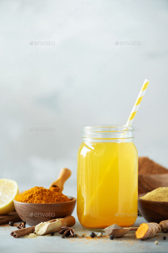Lemon water with ginger, curcuma, black pepper. Vegan hot drink concept. Ingredients for orange - Stock Photo - Images