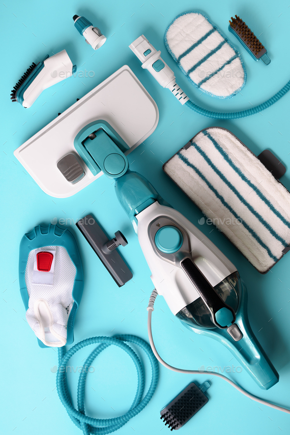 Set with modern professional steam cleaners on blue background. Top view, flat lay. Banner with copy - Stock Photo - Images