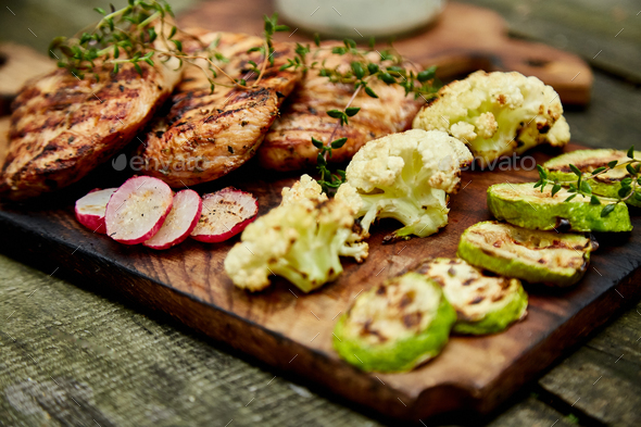 Steak turkey grill on wooden cutting board - Stock Photo - Images