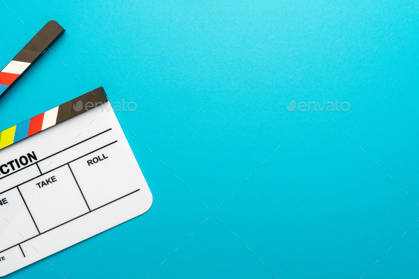 Top View Of Open White Clapperboard On Turquoise Blue Background And Copy Space - Stock Photo - Images
