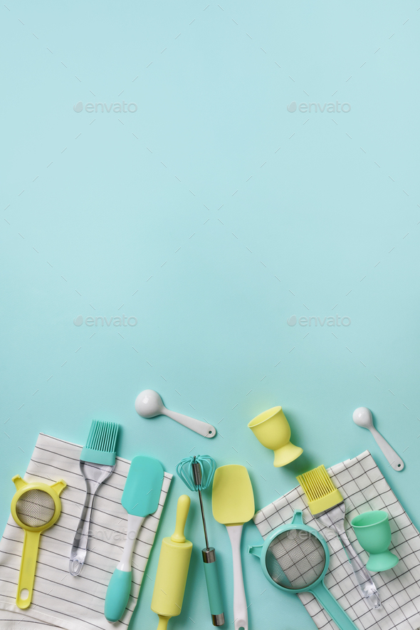 Pastel yellow, blue cooking utensils on turquoise background. Food ingredients. Cooking cakes and - Stock Photo - Images