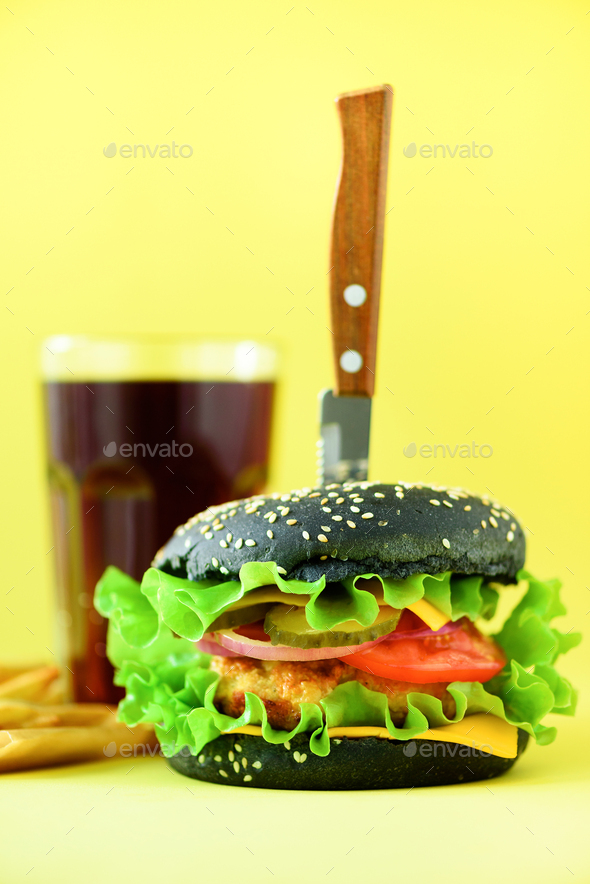 Fast food banner. Juicy meat burgers with cheese, lettuce on yellow background. Take away meal - Stock Photo - Images