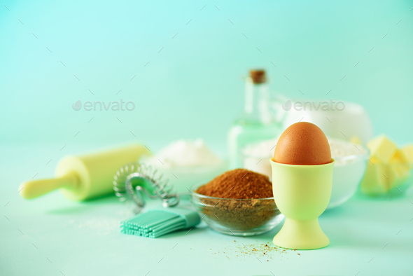 Time to bake. Baking ingredients - butter, sugar, flour, eggs, oil, spoon, rolling pin, brush, whisk - Stock Photo - Images