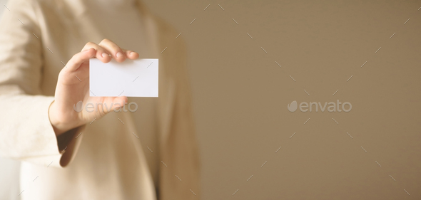 Businessman holding empty business card with copy space. Mock up. Business, study, network concept - Stock Photo - Images