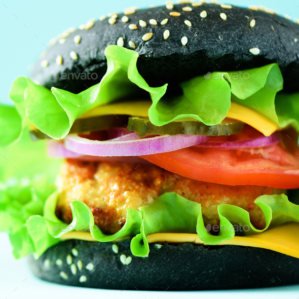 Fast food concept. Square crop. Juicy homemade hamburgers on blue background. Take away meal - Stock Photo - Images