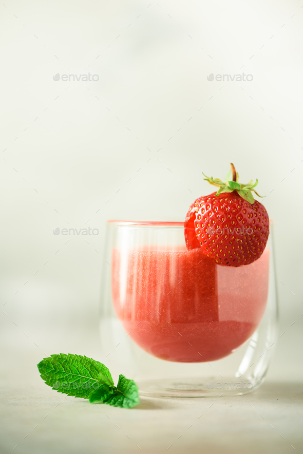 Healthy strawberry smoothie in glass on gray background with copy space. Banner. Summer food and - Stock Photo - Images