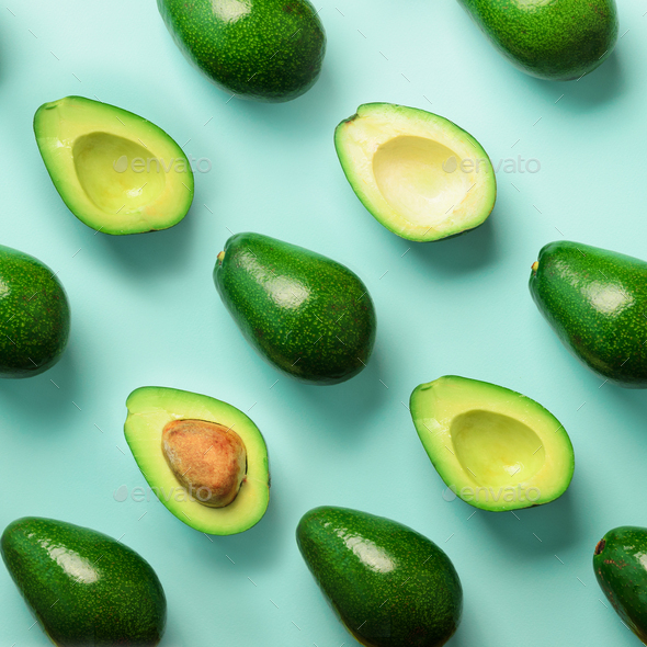 Avocado pattern on blue background. Top view. Banner. Pop art design, creative summer food concept - Stock Photo - Images