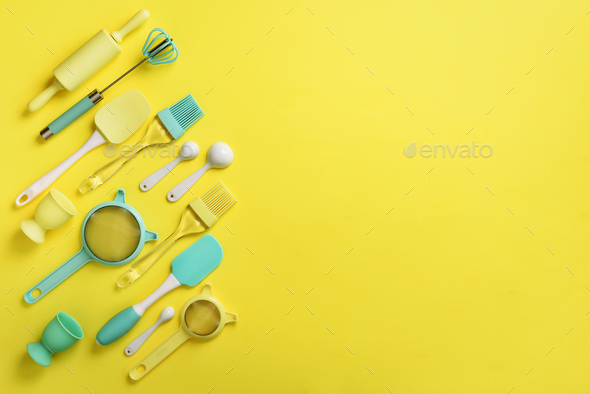 Turquoise cooking utensils on yellow background. Food ingredients. Cooking cakes and baking bread - Stock Photo - Images