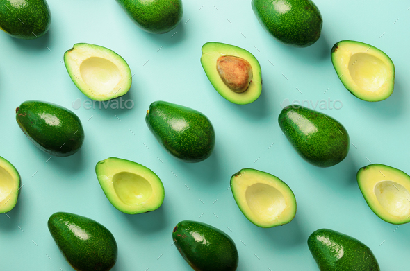 Avocado pattern on blue background. Top view. Banner. Pop art design, creative summer food concept - Stock Photo - Images