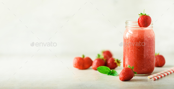 Bottle with vegan strawberry smoothie on grey background with copy space. Banner. Summer food - Stock Photo - Images