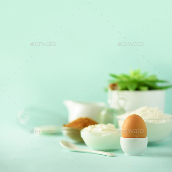 Bakery food frame, cooking concept. Different baking ingredients - butter, sugar, flour, milk, eggs - Stock Photo - Images