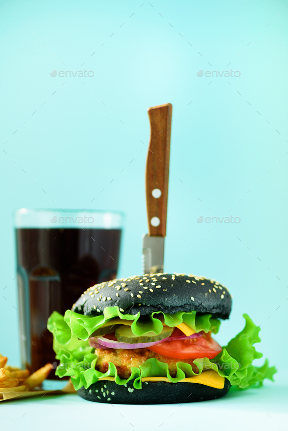 Fast food banner. Juicy meat burgers with cheese, lettuce on blue background. Take away meal - Stock Photo - Images