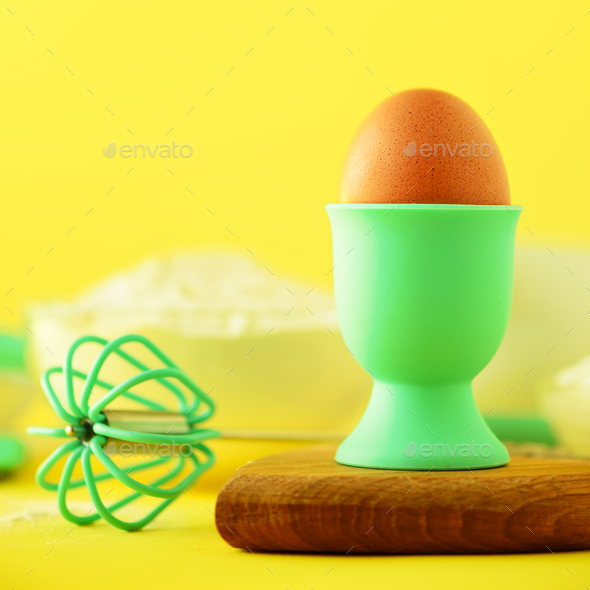 Healthy baking ingredients - butter, sugar, flour, eggs, oil, spoon, rolling pin, brush, whisk, milk - Stock Photo - Images