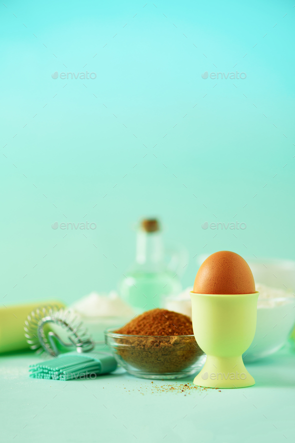 Time to bake. Baking ingredients - butter, sugar, flour, eggs, oil, spoon, rolling pin, brush, whisk - Stock Photo - Images