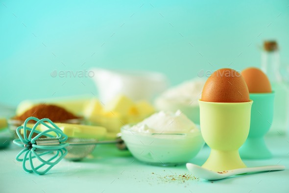 Turquoise cooking utensils on yellow background. Food ingredients. Macro of eggs. Cooking cakes and - Stock Photo - Images