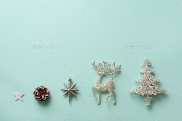 Festive silver dear, stars, fir-tree, cone on blue background with copy space. Christmas and new - Stock Photo - Images