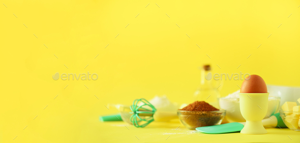 Time to bake. Baking ingredients - butter, sugar, flour, eggs, oil, spoon, rolling pin, brush, whisk - Stock Photo - Images