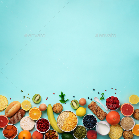 Healthy breakfast ingredients, food frame. Square crop. Oat and corn flakes, eggs, nuts, fruits - Stock Photo - Images