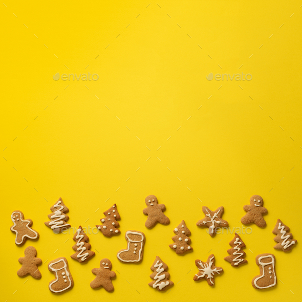 Homemade christmas cookies on yellow background with copy space. Square crop. Pattern of gingerbread - Stock Photo - Images