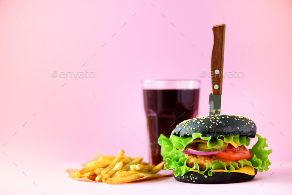 Fast food banner. Juicy meat burgers with cheese, lettuce on pink background.  Take away meal Stock Photo by jchizhe