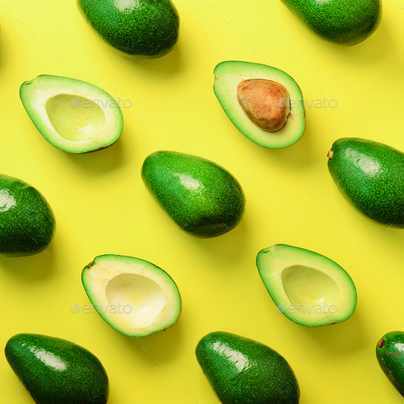 Avocado pattern on yellow background. Top view. Banner. Pop art design, creative summer food concept - Stock Photo - Images
