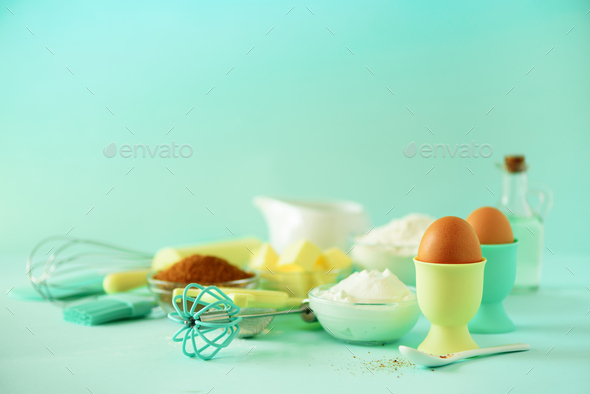 Bakery food frame, cooking concept. Different baking ingredients - butter, sugar, flour, milk, eggs - Stock Photo - Images