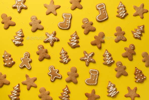 Christmas handmade cookies on pink background. Pattern of gingerbread men, snowflake, star, fir-tree - Stock Photo - Images