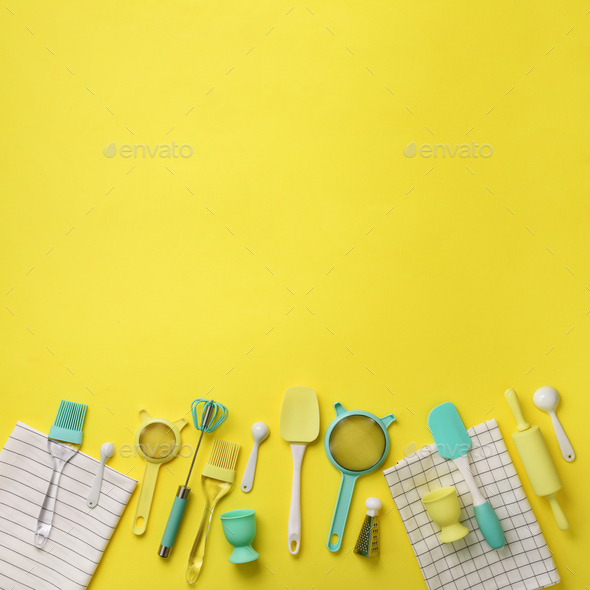 Turquoise cooking utensils on yellow background. Food ingredients. Cooking cakes and baking bread - Stock Photo - Images