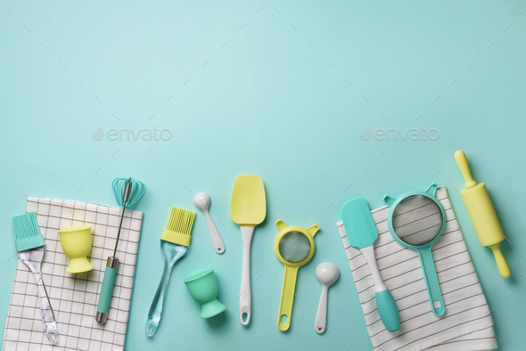 Time to cook. Pastel yellow, blue cooking utensils on turquoise background. Food ingredients - Stock Photo - Images