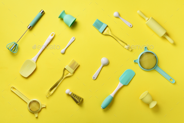 Turquoise cooking utensils on yellow background. Food ingredients. Cooking cakes and baking bread - Stock Photo - Images