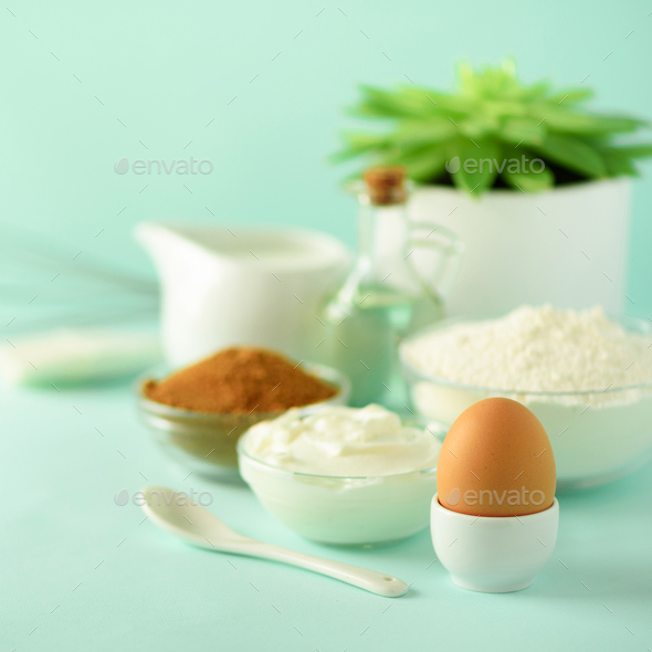Bakery food frame, cooking concept. Different baking ingredients - butter, sugar, flour, milk, eggs - Stock Photo - Images