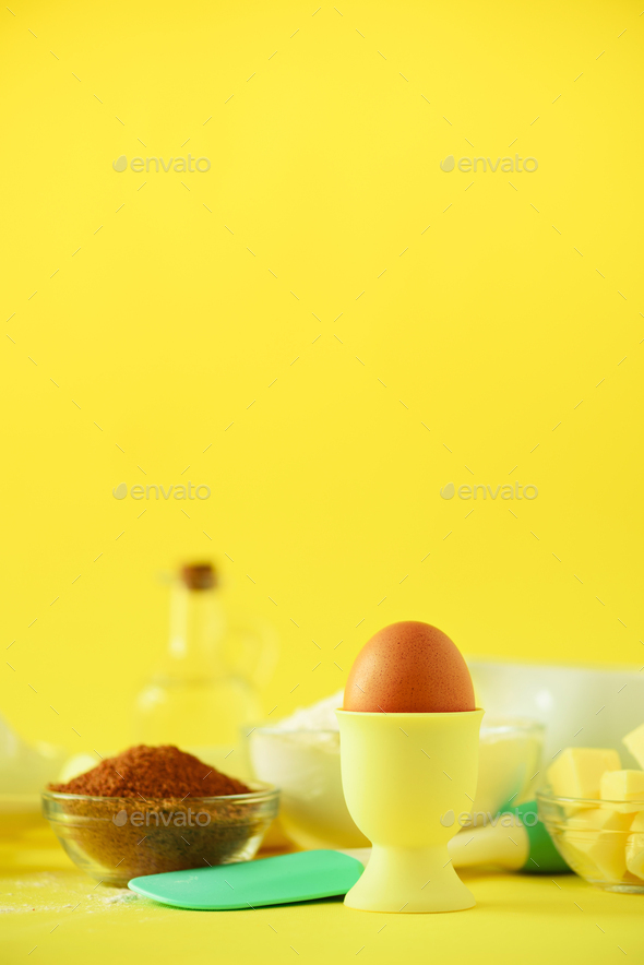 Healthy baking ingredients - butter, sugar, flour, eggs, oil, spoon, rolling pin, brush, whisk, milk - Stock Photo - Images